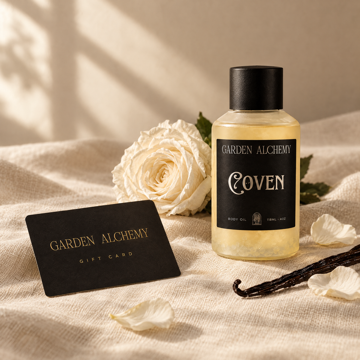 Garden Alchemy gift card on linen with a white rose